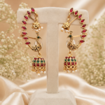 Peacock ear cuff jhumka earrings with red stones, green detailing and pearl drops