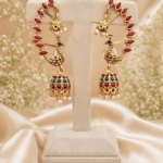 Peacock ear cuff jhumka earrings with red stones, green detailing and pearl drops