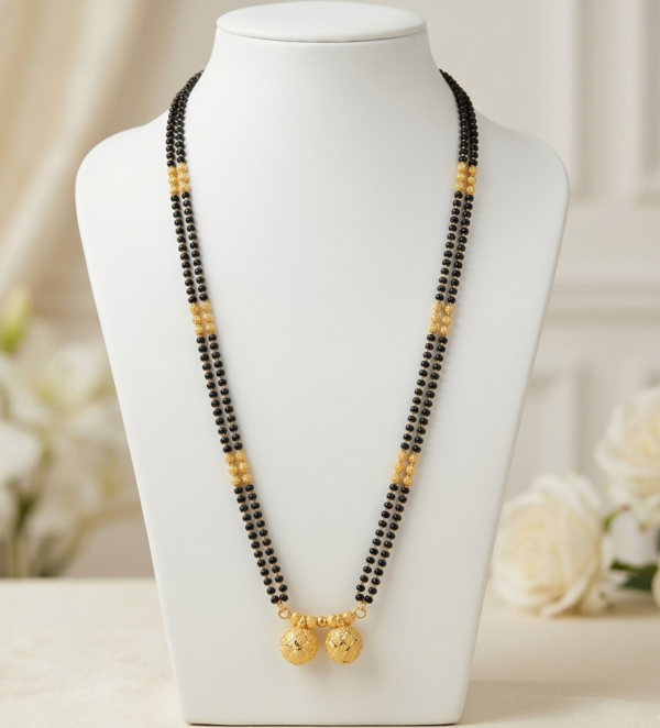 Long two line black bead mangalsutra with gold bead clusters and twin round pendants