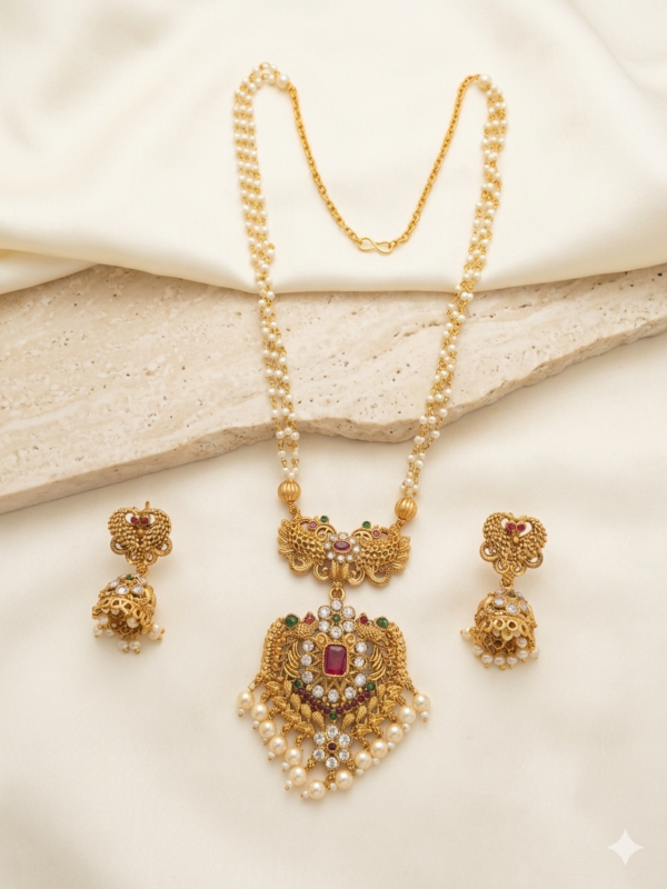 Long Pearl Mala Necklace and Jhumka Earrings Set Long pearl mala necklace set with antique gold pendant, pearl drops and matching jhumka earrings