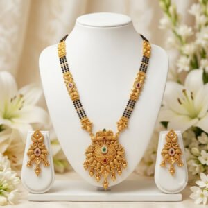 Traditional black bead mangalsutra necklace with gold-tone pendant and matching earrings