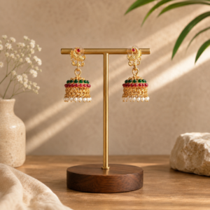 Matte Gold Finish Peacock Jhumka Earrings Matte Gold Finish Peacock Jhumka Earrings with Red Green Beads