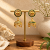Elephant Motif Matte Gold Jhumka Earrings with Green Stones
